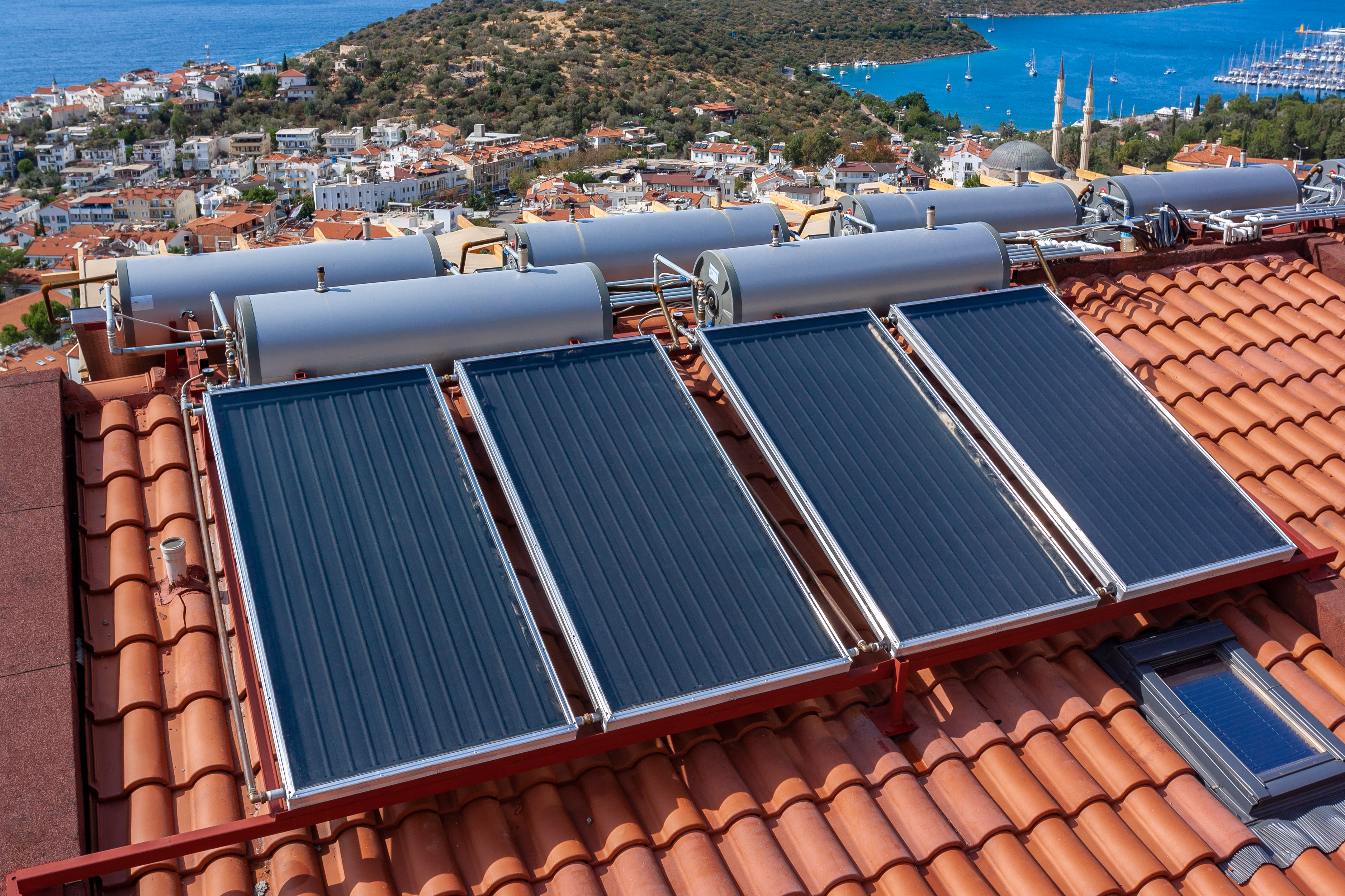 solar-water-heater-installed-tile-roof-house-eco-heating-water-large-water-tanks-horizontal-photo (1).jpg