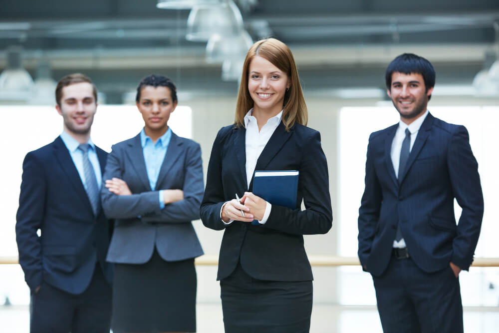 businesspeople-standing-together-office.jpg