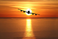 beautiful-sunset-airplane-over-sea-30281869.jpg