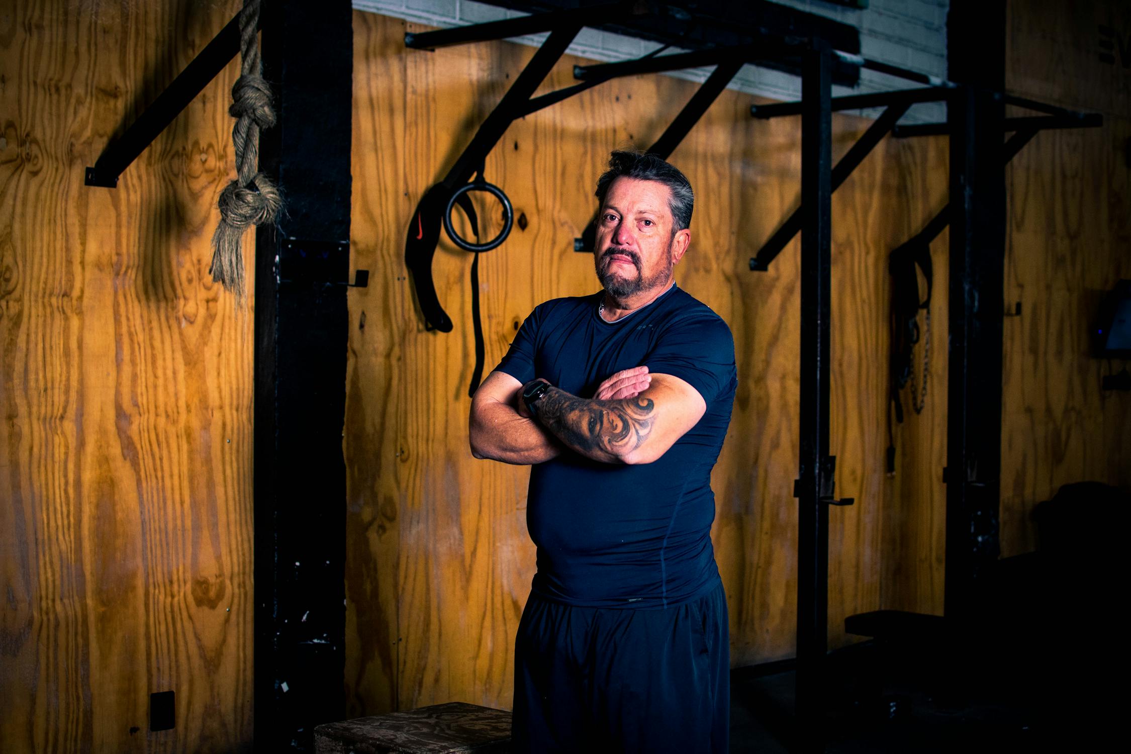free-photo-of-a-bearded-man-standing-next-to-a-machine-at-the-gym.jpeg