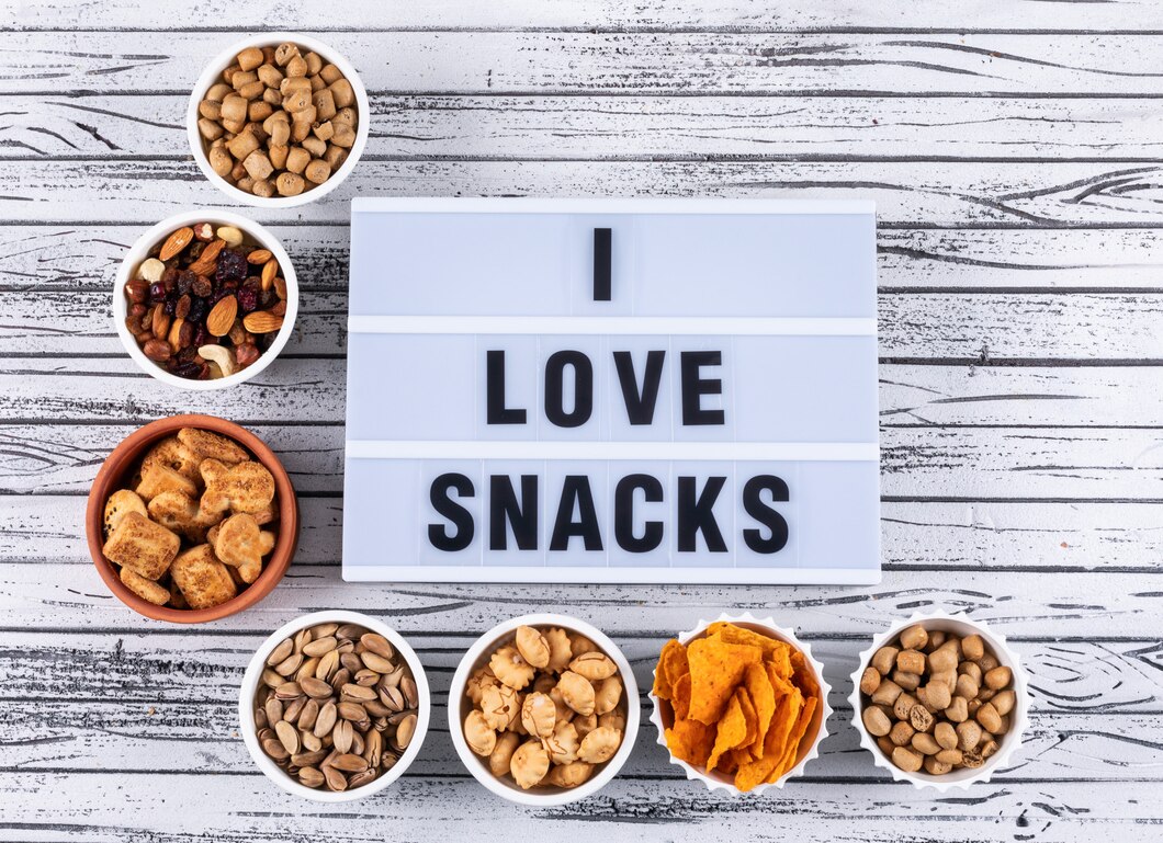 top-view-different-kind-snacks-as-nuts-crackers-cookies-bowls-white-wooden-surface-horizontal_176474-954.jpg