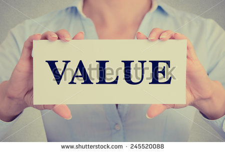 stock-photo-business-woman-hands-holding-white-card-with-value-word-sign-isolated-on-grey-wall-office-245520088.jpg