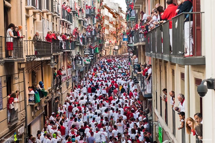 Bull-running-in-the-calle-Estafeta-in-Pamplona-Spain.jpg