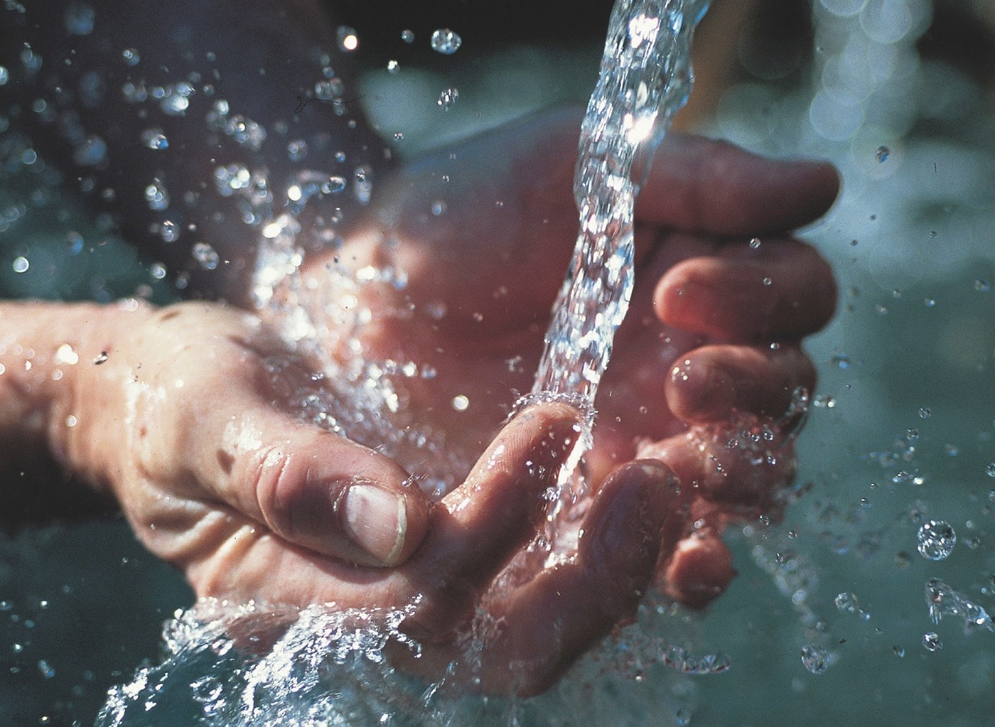 a-pair-of-hands-trying-to-capture-water-from-a-running-tap-d024452ae2d7490fcf45cef5aef8c9b5.jpg