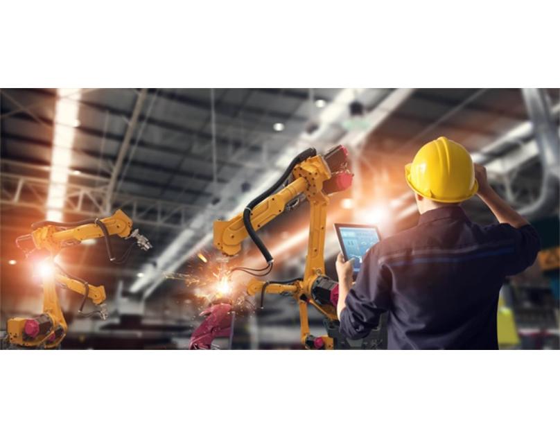 An-industrial-automation-technician-is-setting-up-a-big-robotic-arm.jpg