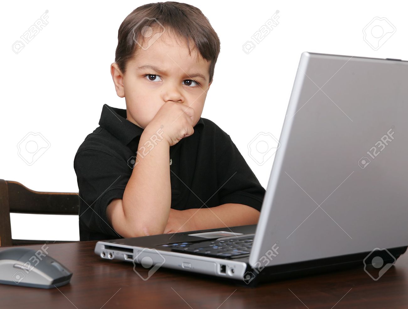 3111471-a-child-looking-unhappy-or-thinking-while-working-on-a-laptop-computer.jpg