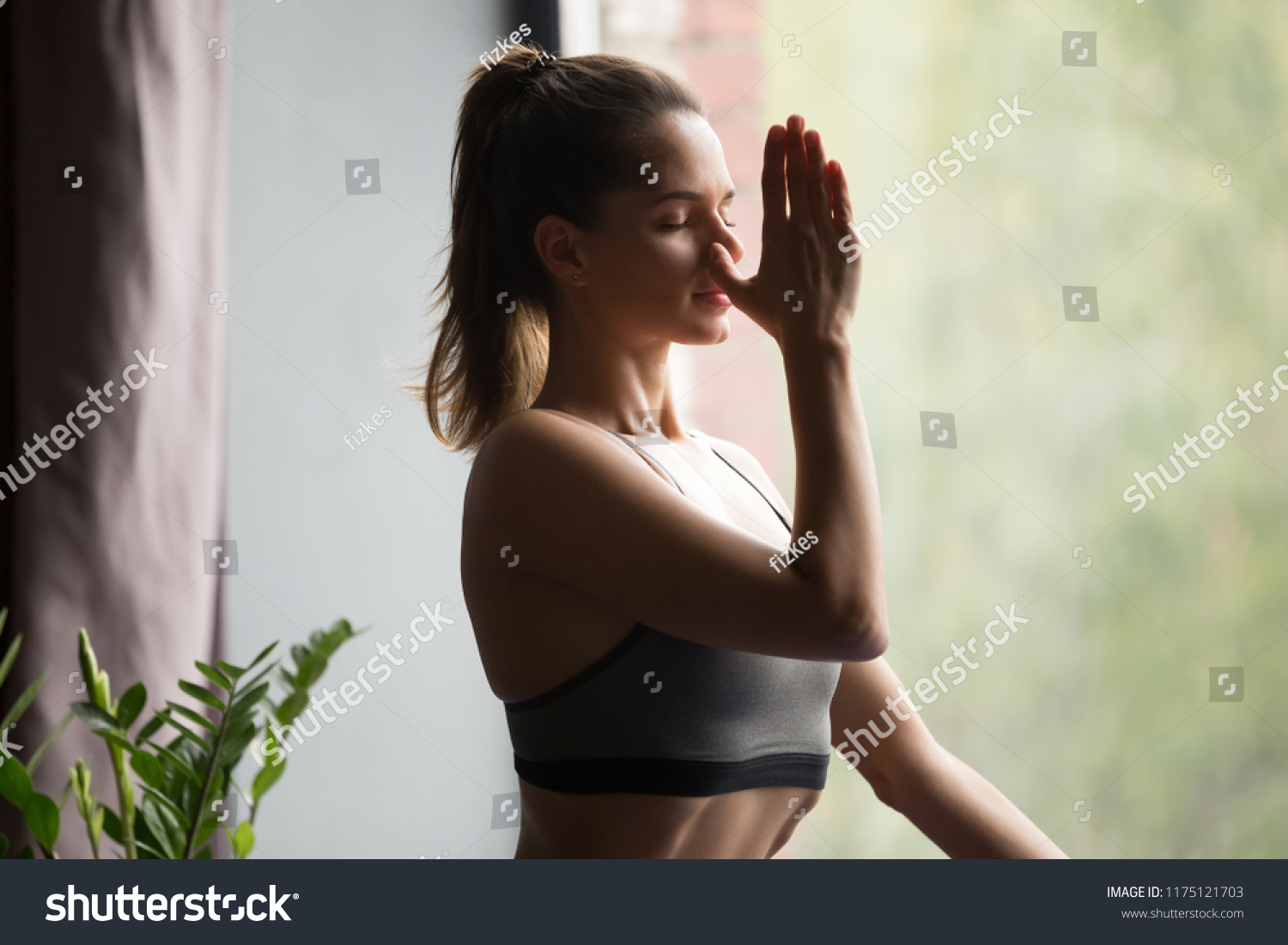 stock-photo-young-attractive-woman-practicing-yoga-doing-alternate-nostril-breathing-exercise-nadi-shodhana-1175121703.jpg