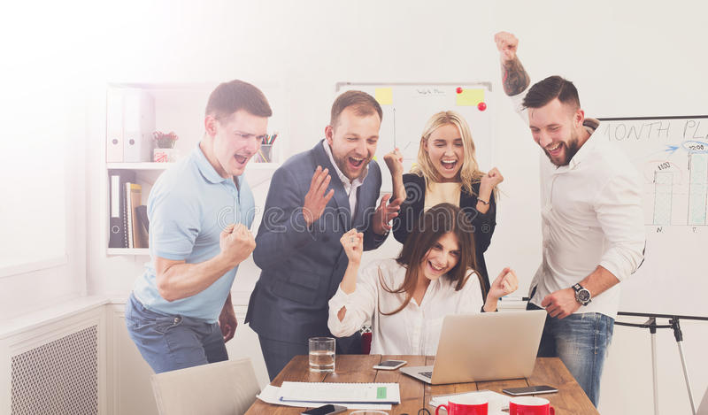happy-business-people-team-celebrate-success-office-looking-laptop-screen-successful-corporate-partners-coworkers-80334617.jpg