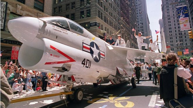 A Navy jet is pulled down Broadway Avenue in a June 1991 welcome ho![