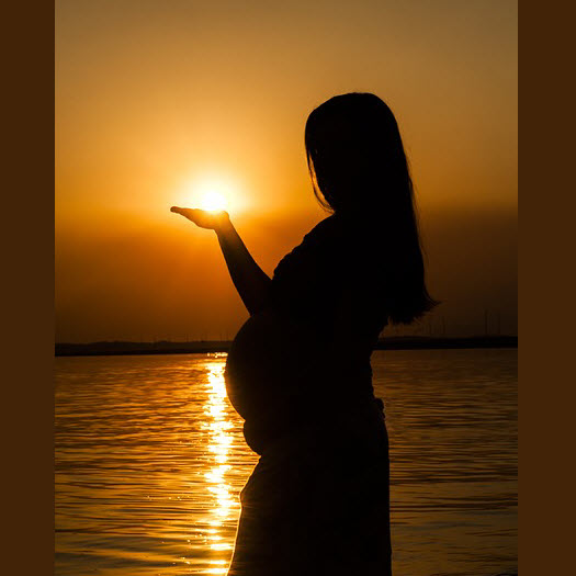 silloquette of pregnant woman in sunset.jpg