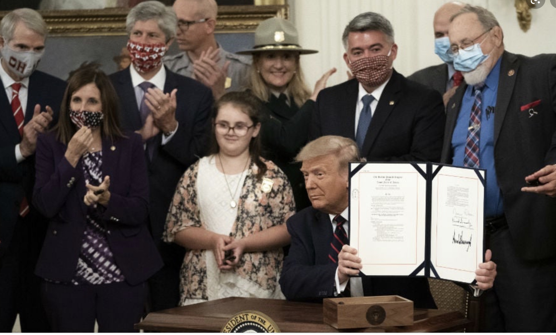 Trump signs Bill.jpg