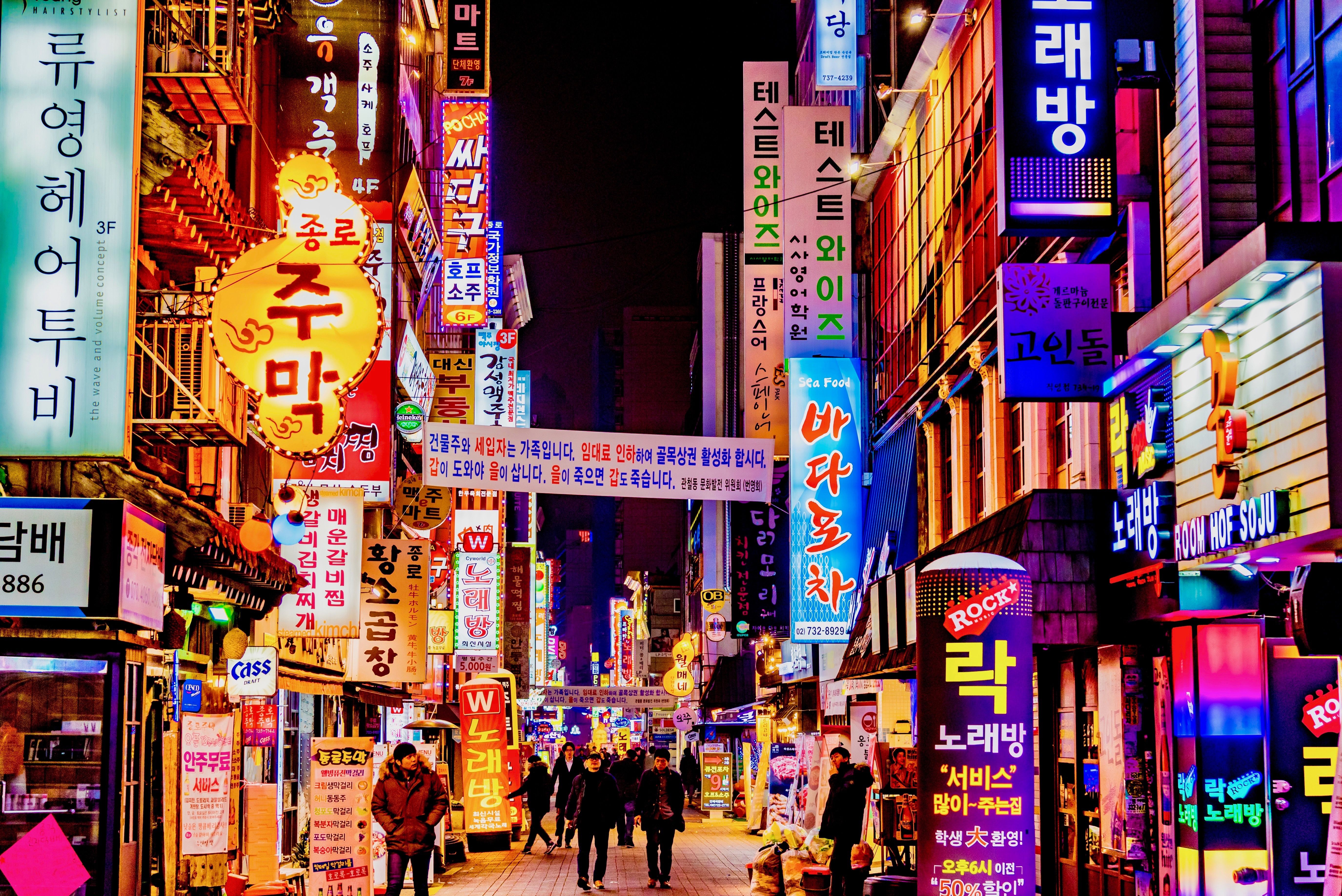 illuminated-buildings-and-city-street-at-night-902452584-94fe3f3db5374dbbb82cc2372534be28.jpg