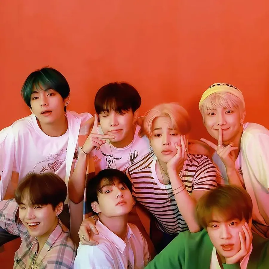 cute-bts-group-on-orange-backdrop-43csy39a8ua0fzaq.webp