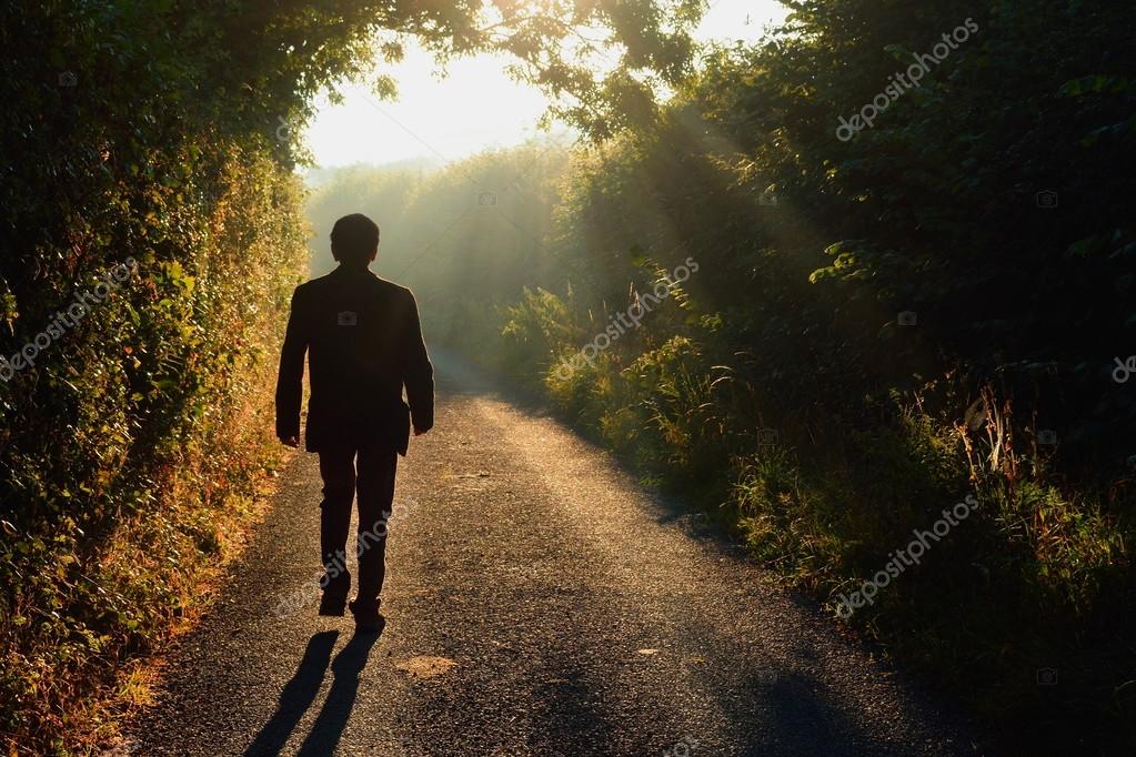 depositphotos_121911280-stock-photo-man-walking-along-a-small.jpg