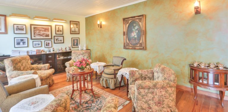 The charming sitting room creates an aura of English style.jpg