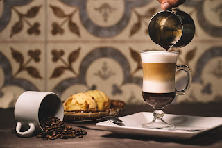 barista-pouring-syrup-into-layered-latte (1).jpg