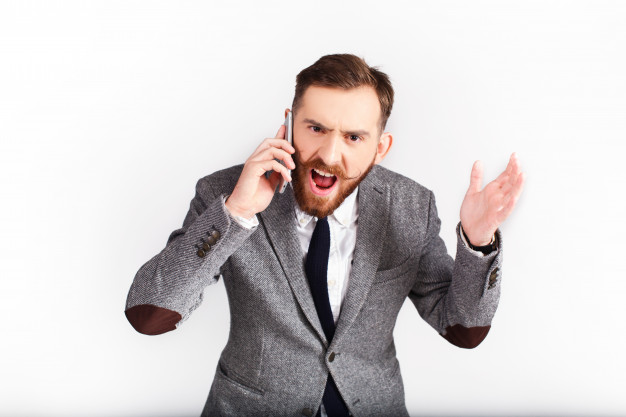 angry-man-in-grey-suit-talks-on-the-phone_8353-1253.jpg
