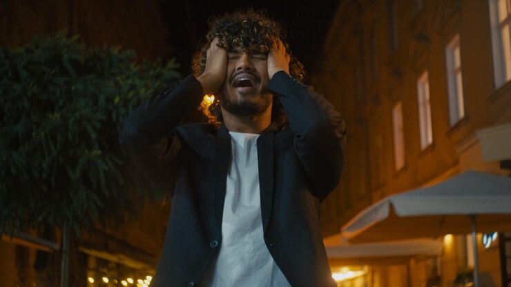 upset-arabian-latino-indian-american-man-outside-city-dissatisfied-screaming-hold-head-problem_717737-16130.jpg