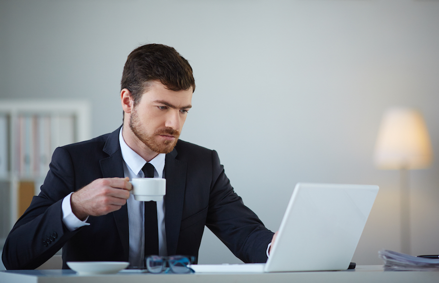bigstock-Handsome-businessman-using-lap-66068197.jpg