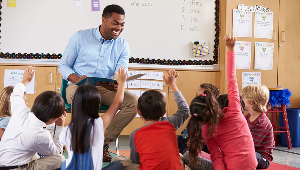 Teacher-with-Students-raising-their-hands-Feature-Image.jpg