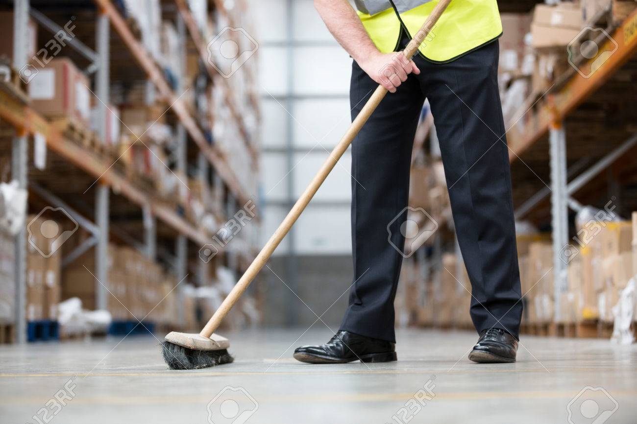 82295981-man-sweeping-warehouse-floor-with-broom.jpg
