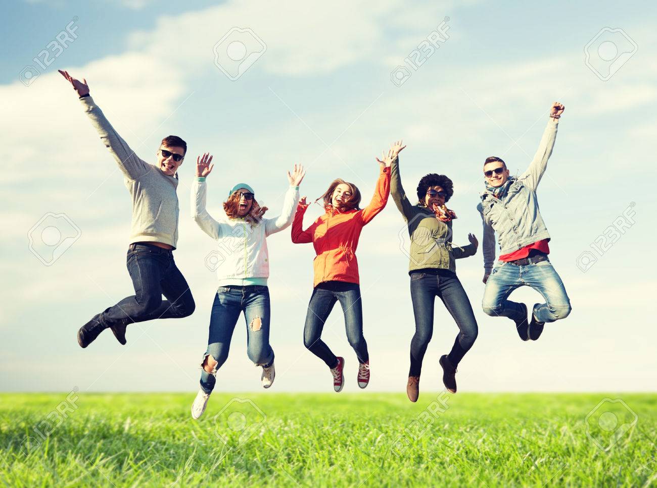 61136560-people-freedom-happiness-and-teenage-concept-group-of-happy-friends-in-sunglasses-jumping-high-over- (1).jpg