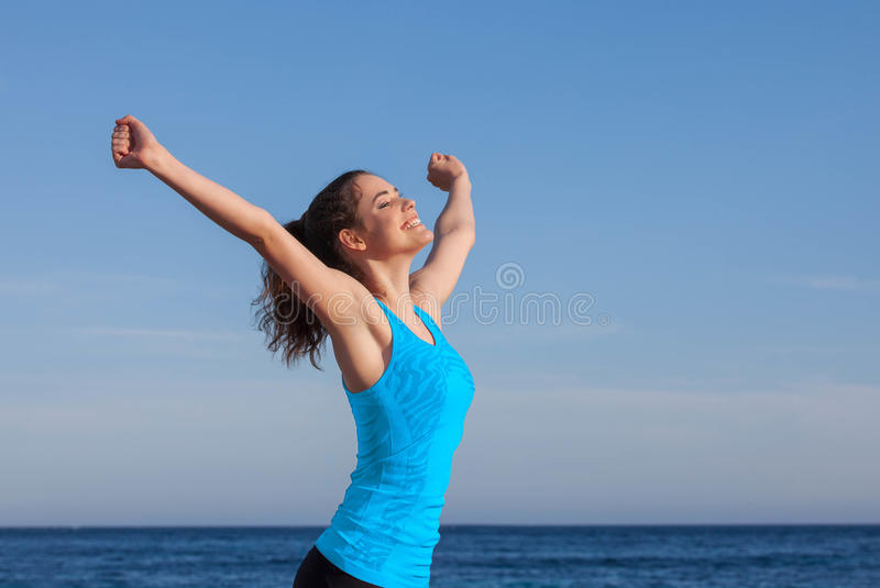 happy-person-arms-raised-outstretched-69762123.jpg