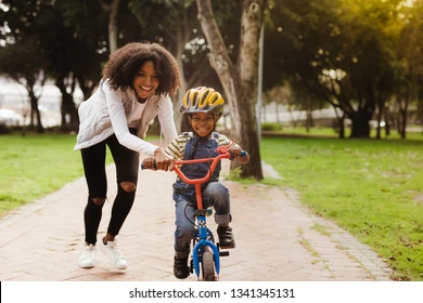 happy-cute-boy-learn-ride-260nw-1341345131.webp