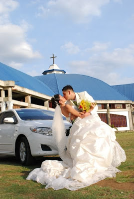 Groom kissing bride.JPG