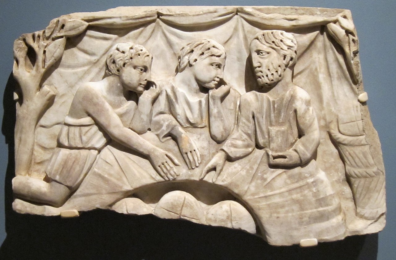 1280px-Marble_relief_showing_a_refrigerium_(annual_commemorative_meal_for_the_dead)_from_the_vicinity_of_Ankara,_Turkey,_3rd_Century_CE,_Honolulu_Academy_of_Arts.jpg