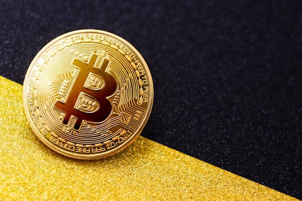 free-photo-of-close-up-of-a-bitcoin-on-a-black-gold-background (1).jpeg