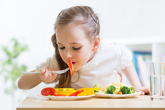 girlEatingVegetables_330x220.jpg