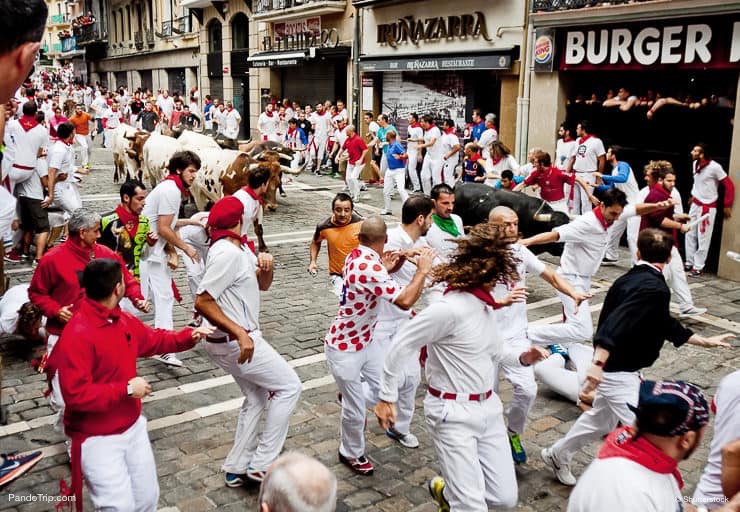 Bulls-and-people-are-running-in-street-during-San-Fermin-festival.jpg