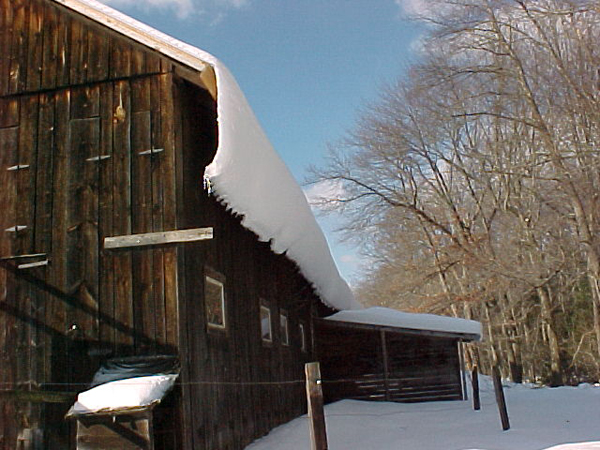 Snow.off.roof.north.side.barn crop.Jan.03.jpg