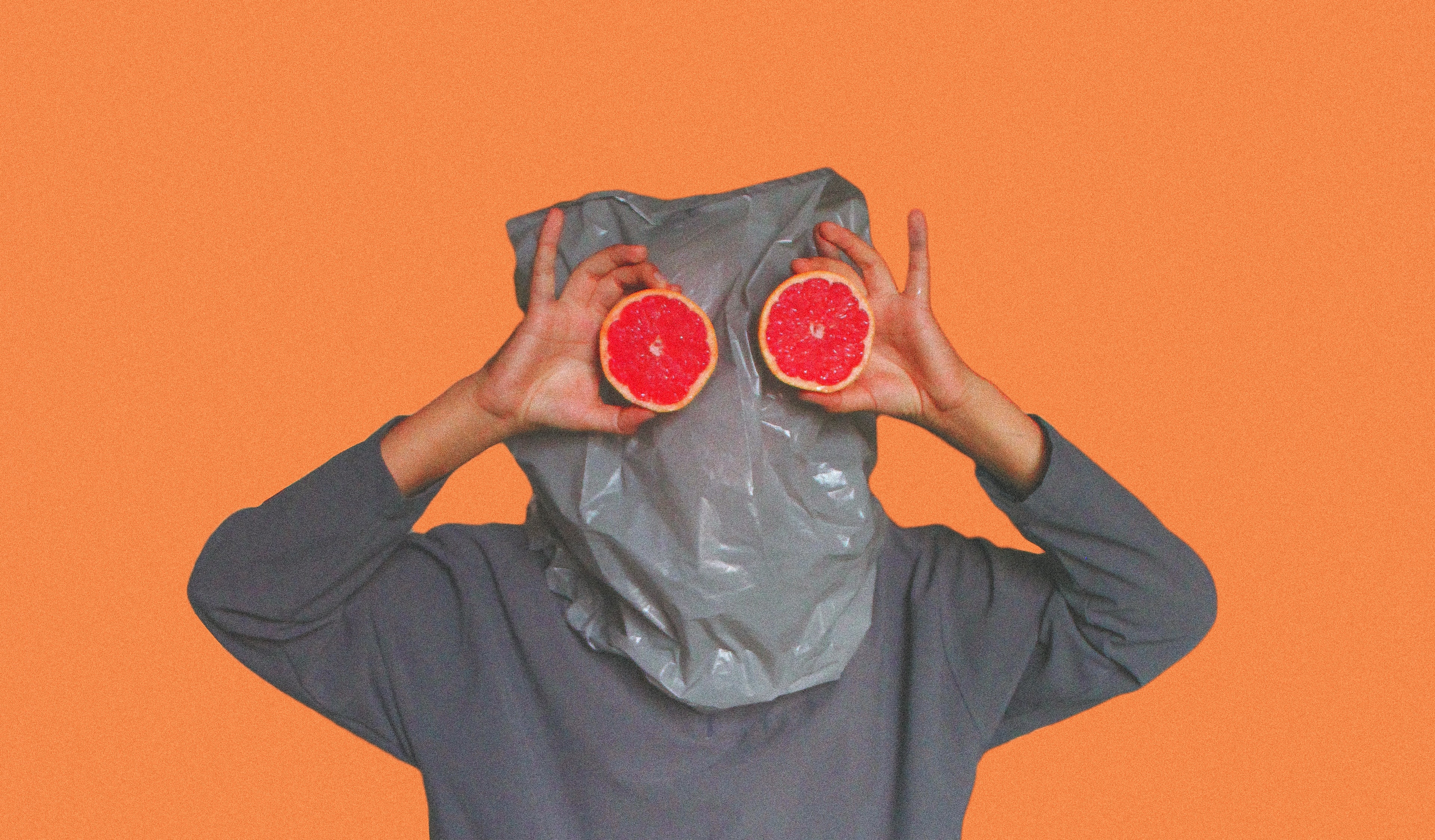 person-covered-with-plastic-bag-on-head-while-holding-sliced-3317038.jpg