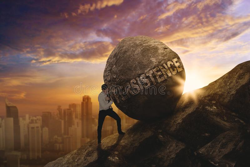 american-businessman-pushing-persistence-word-american-businessman-pushing-big-stone-persistence-word-climbing-105672278.jpg