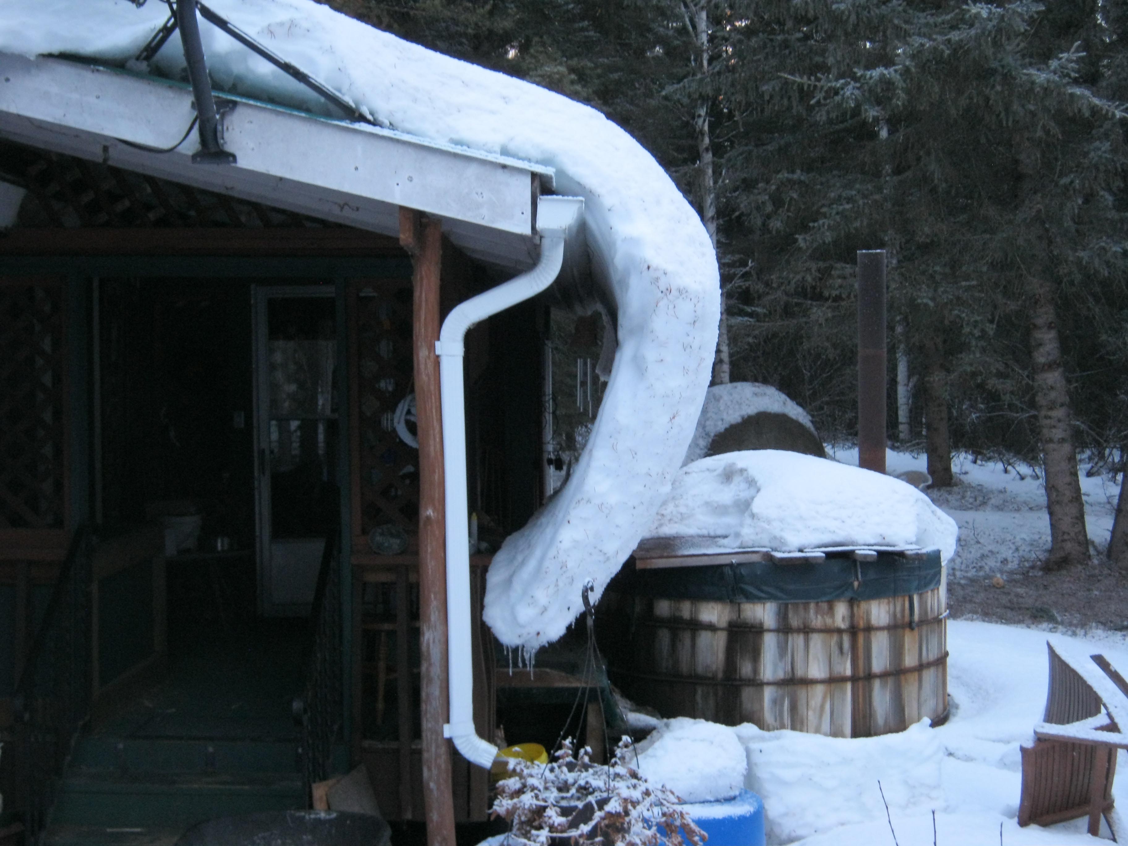 snow creeping off roof.jpg