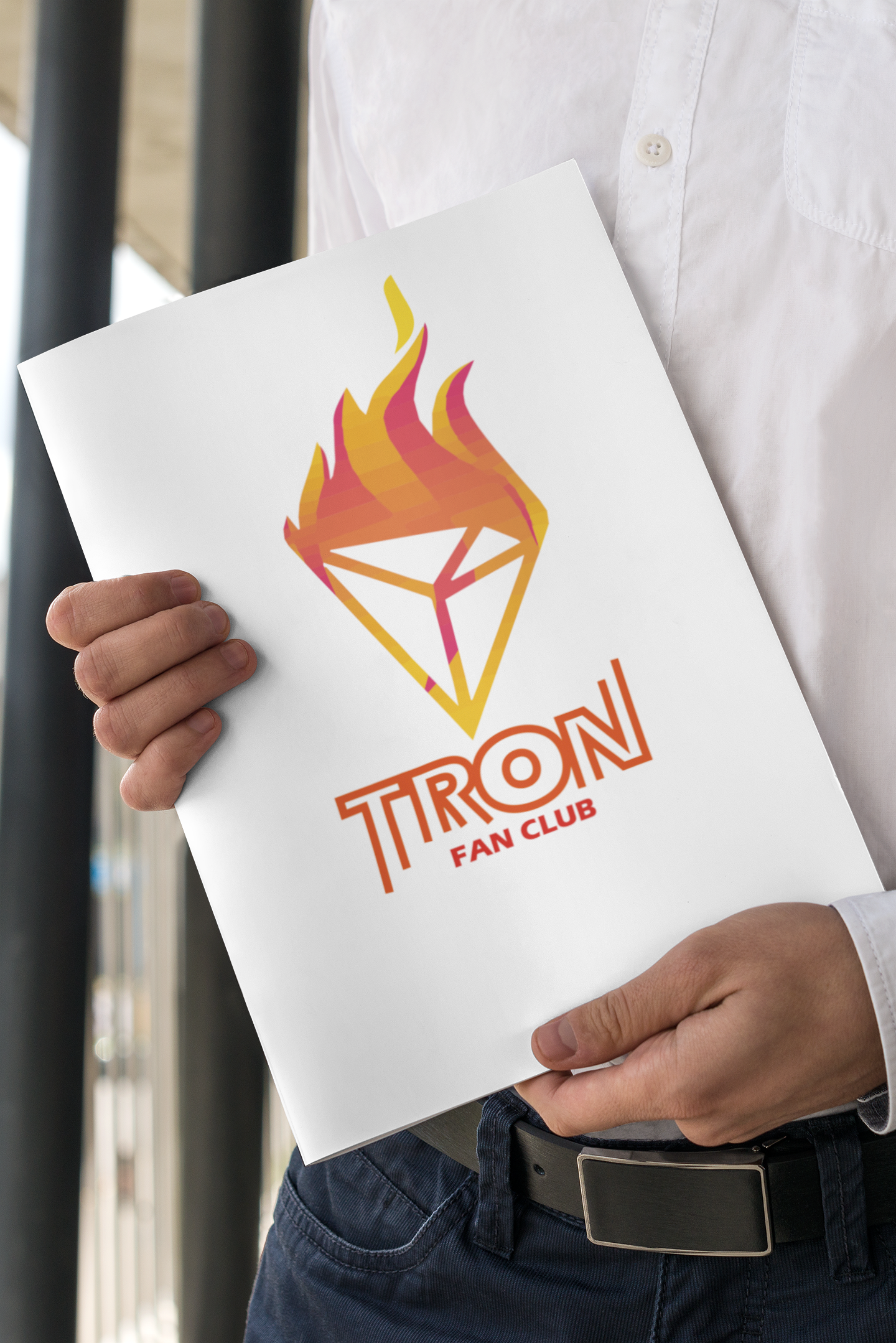 mockup-of-a-formal-man-holding-a-magazine-3388-el1 (1).png