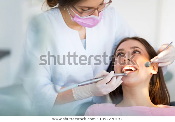 dentist-patient-office-600w-1052270132.webp