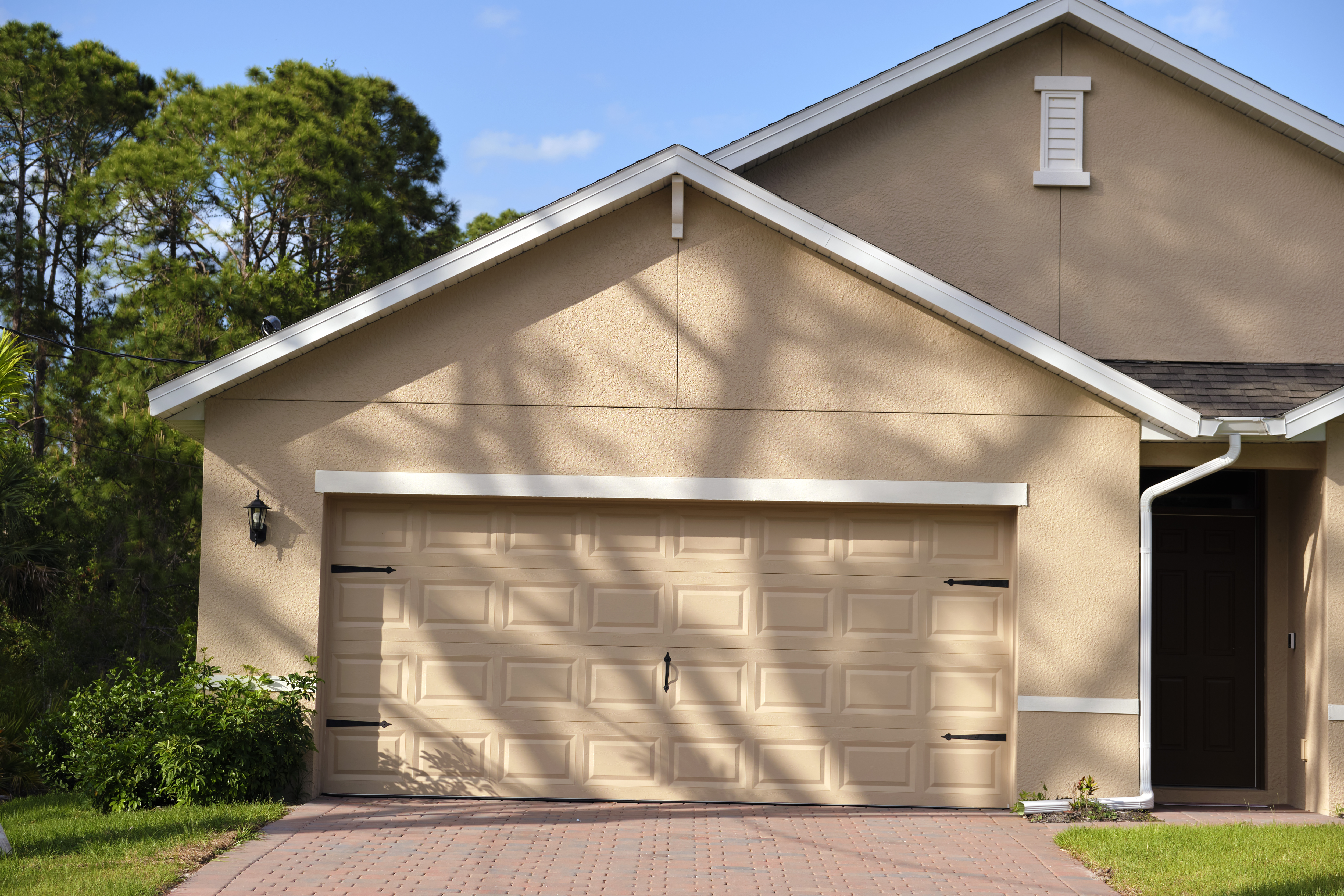 wide-garage-double-door-and-concrete-driveway-of-n-2026-03-17-05-06-24-utc.jpg