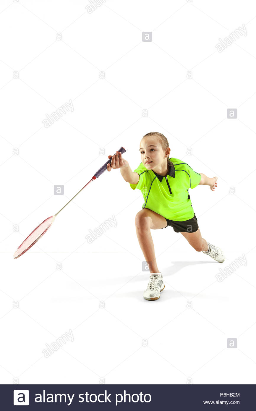 the-one-caucasian-young-teenager-girl-playing-badminton-at-studio-the-female-teen-player-isolated-on-white-background-in-motion-R6HB2M.jpg