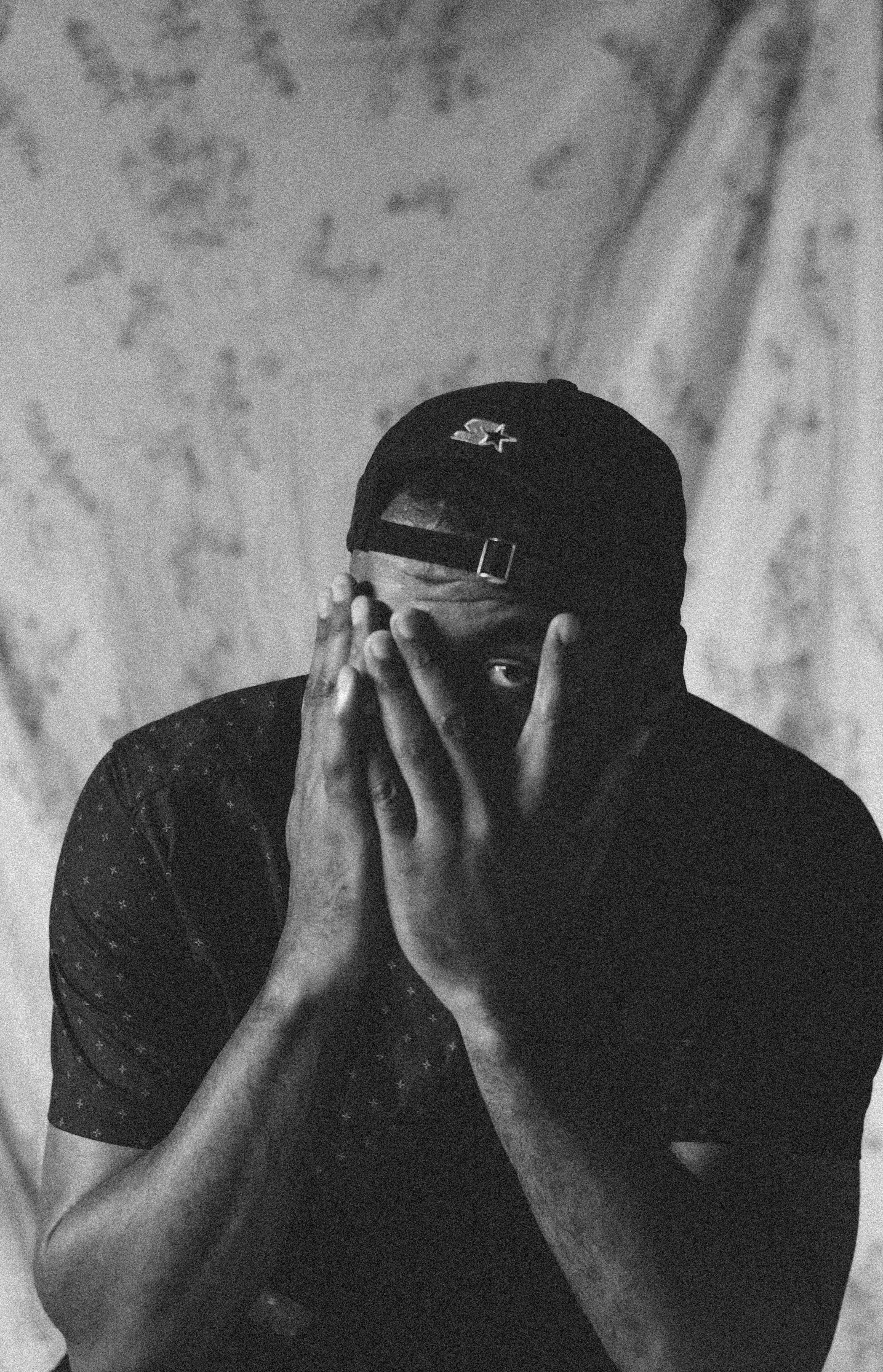 monochrome-photo-of-a-man-hiding-his-face-2954393.jpg