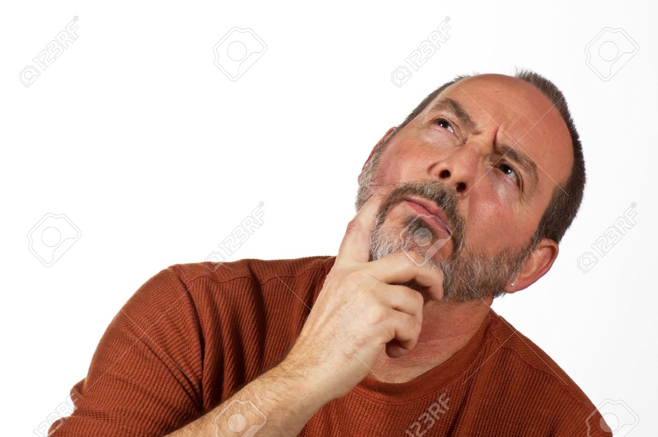12586185-middle-aged-man-with-hand-on-beard-looking-up-thinking.jpg