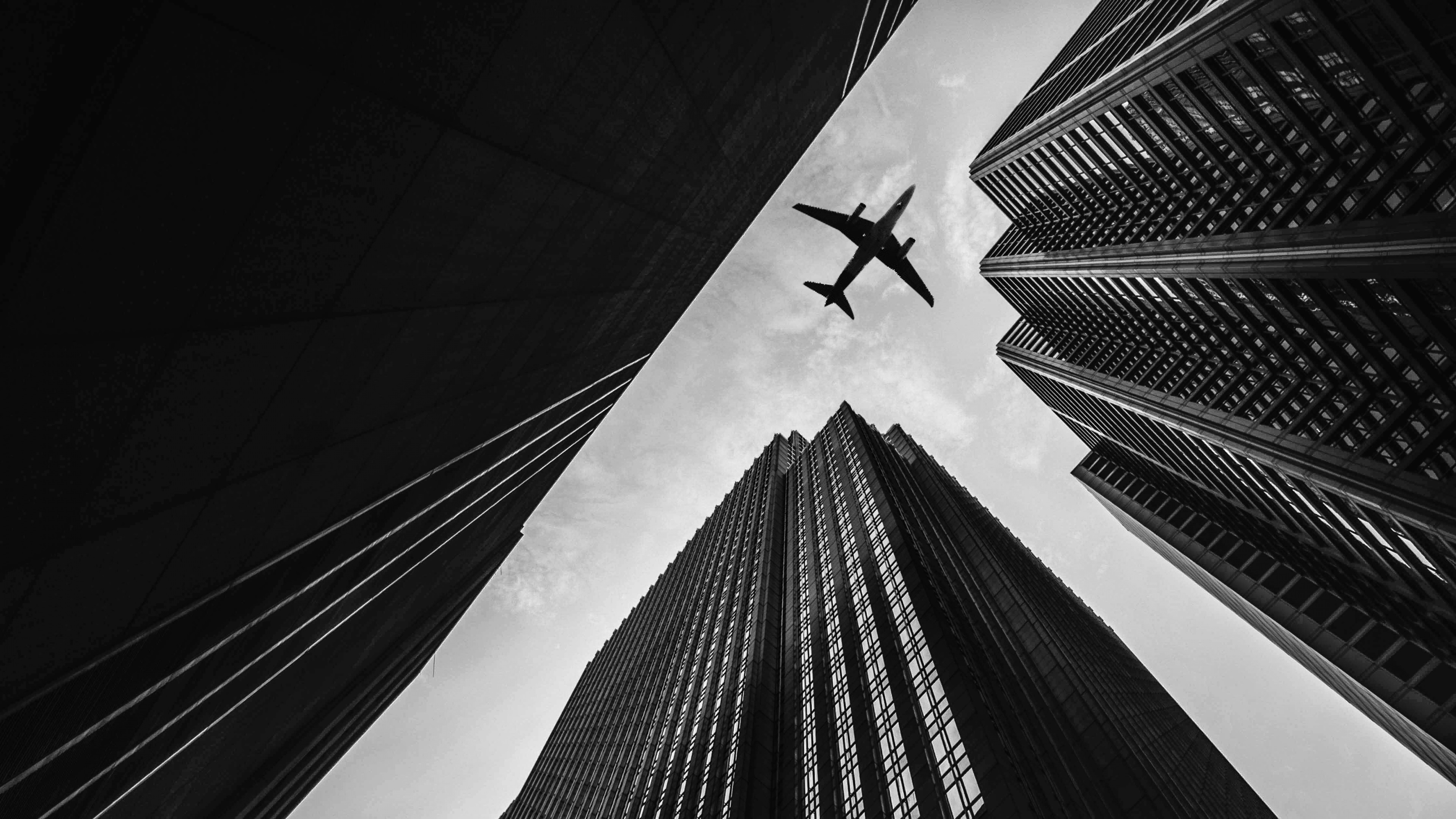 airplane_buildings_skyscrapers_sky_120051_3840x2160.jpg