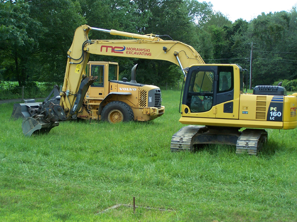 Bucket loader in front pasture crop July 2019.jpg